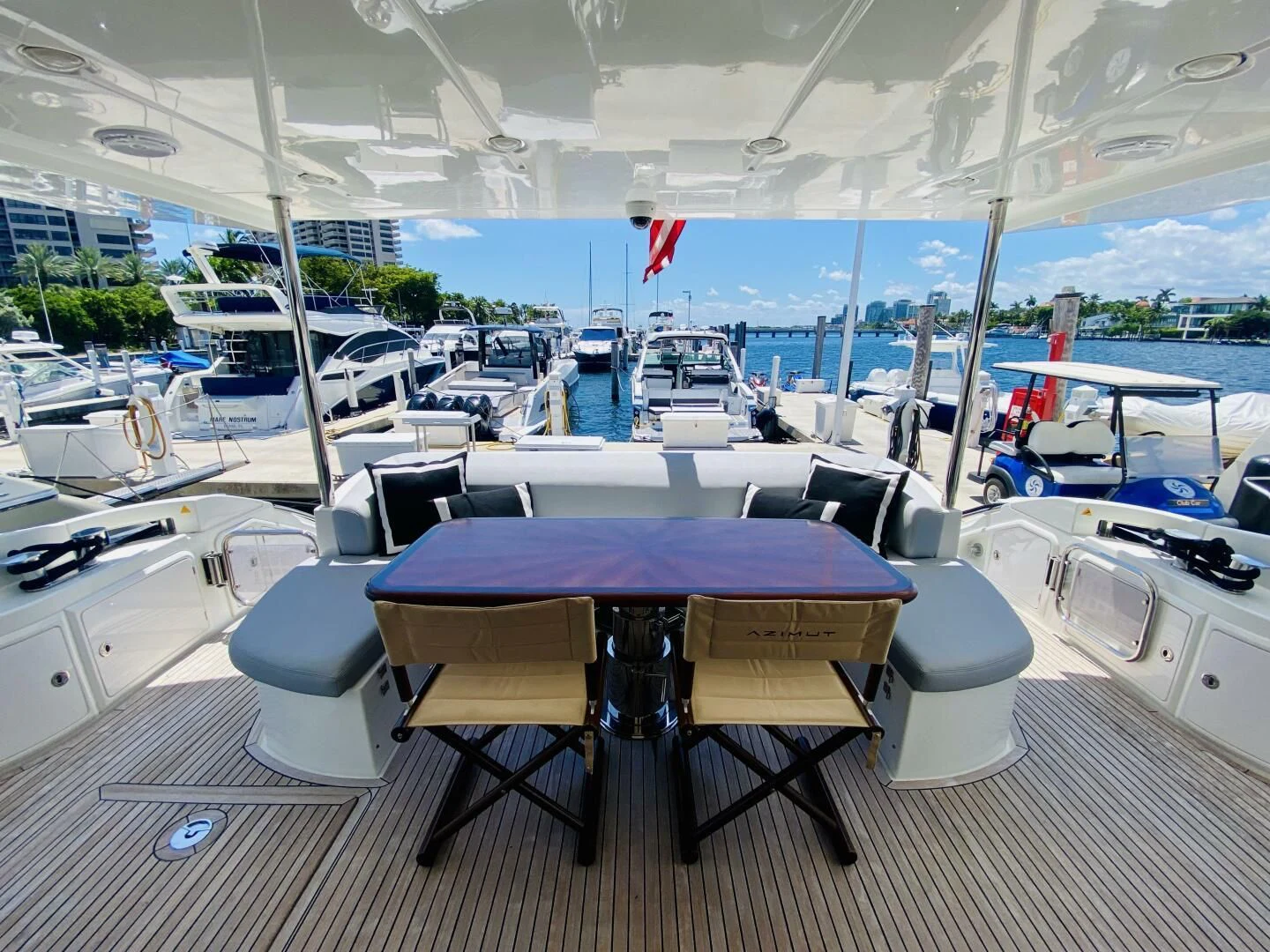 a table and chairs on a deck aboard SOMEWHERE I BELONG Yacht for Sale