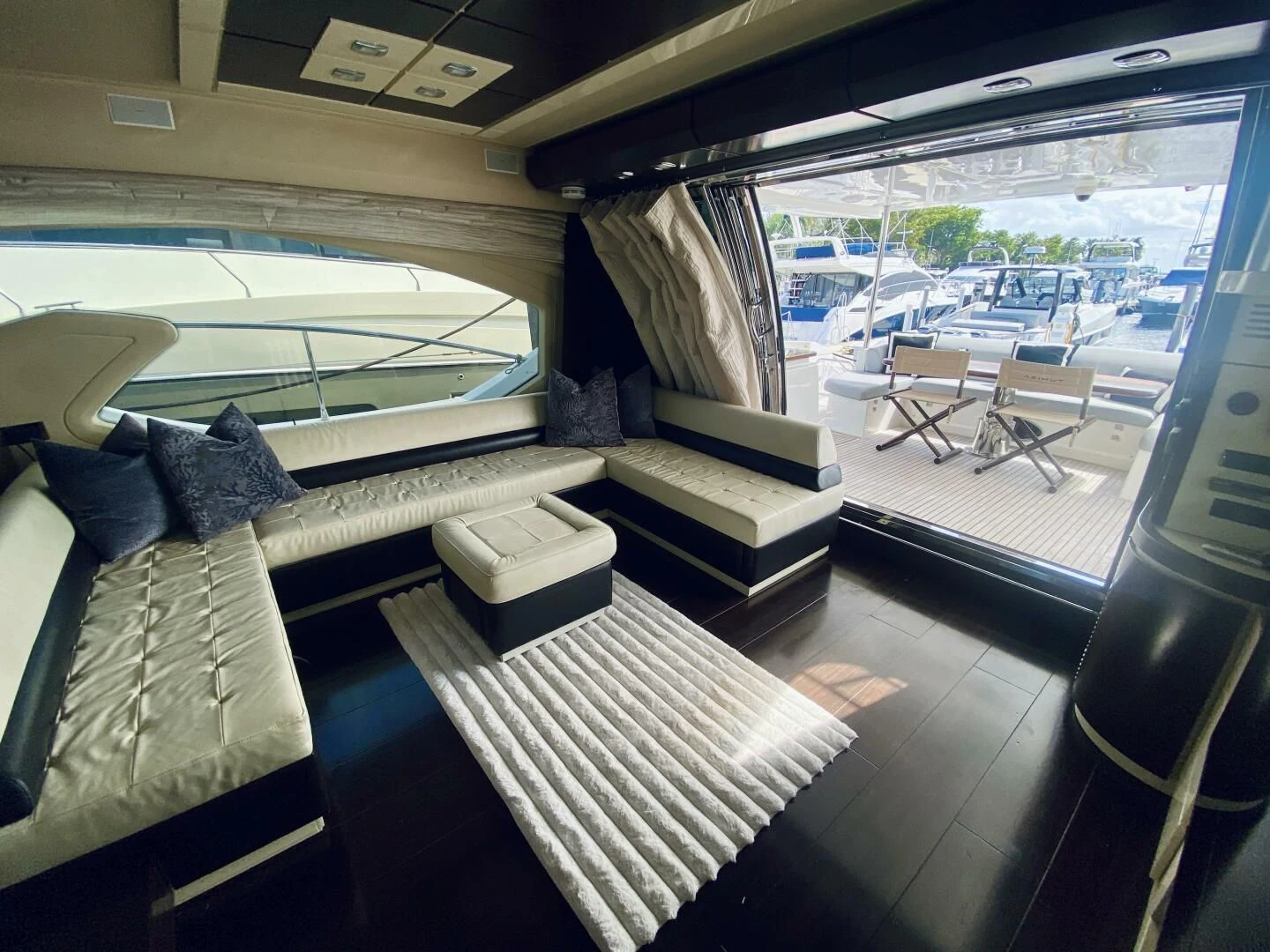 inside of a vehicle with a large window and a view of the water aboard SOMEWHERE I BELONG Yacht for Sale