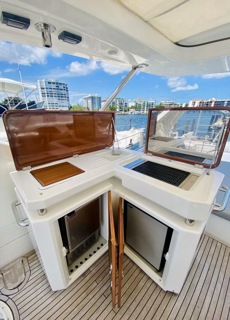 a piano with a seat on it aboard SOMEWHERE I BELONG Yacht for Sale