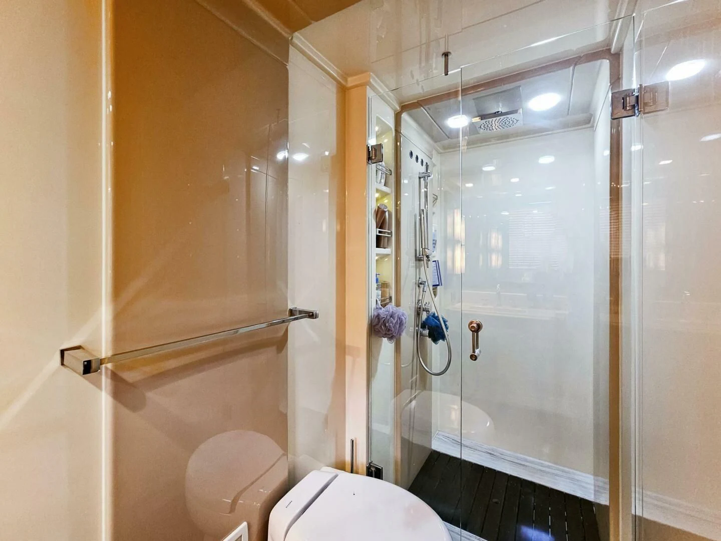 a bathroom with a glass shower aboard SOMEWHERE I BELONG Yacht for Sale