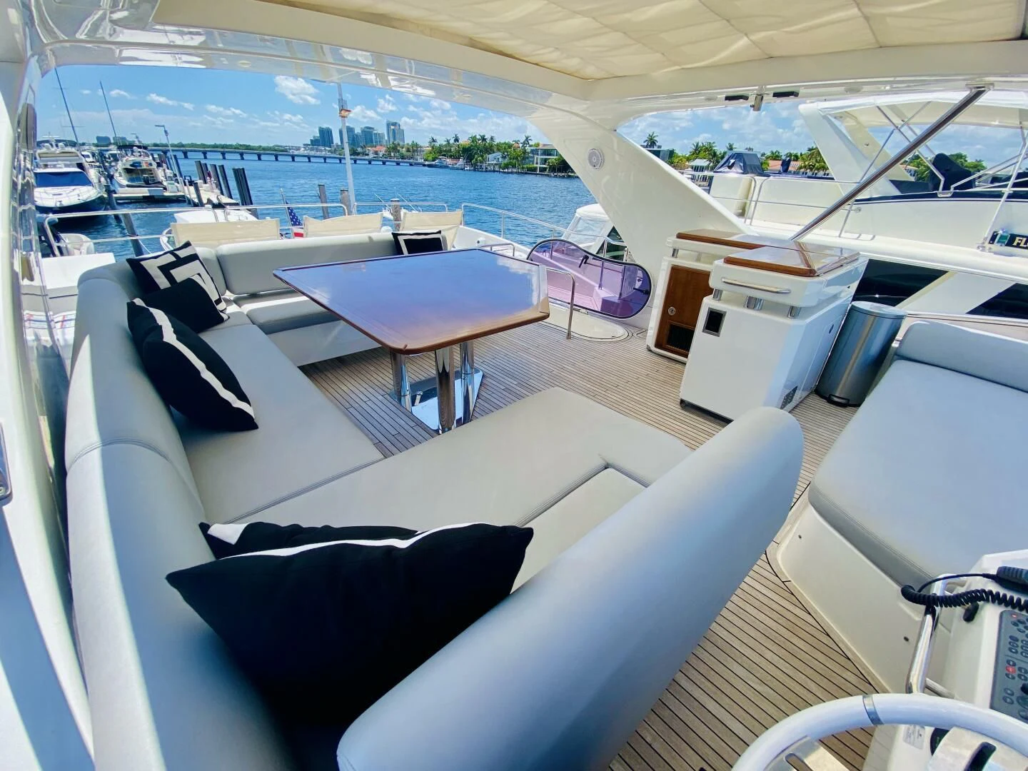 a boat with a table and chairs aboard SOMEWHERE I BELONG Yacht for Sale