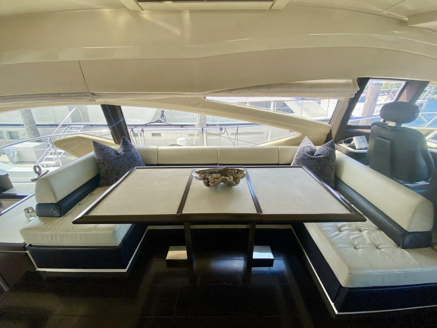 a room with a table and chairs aboard SOMEWHERE I BELONG Yacht for Sale