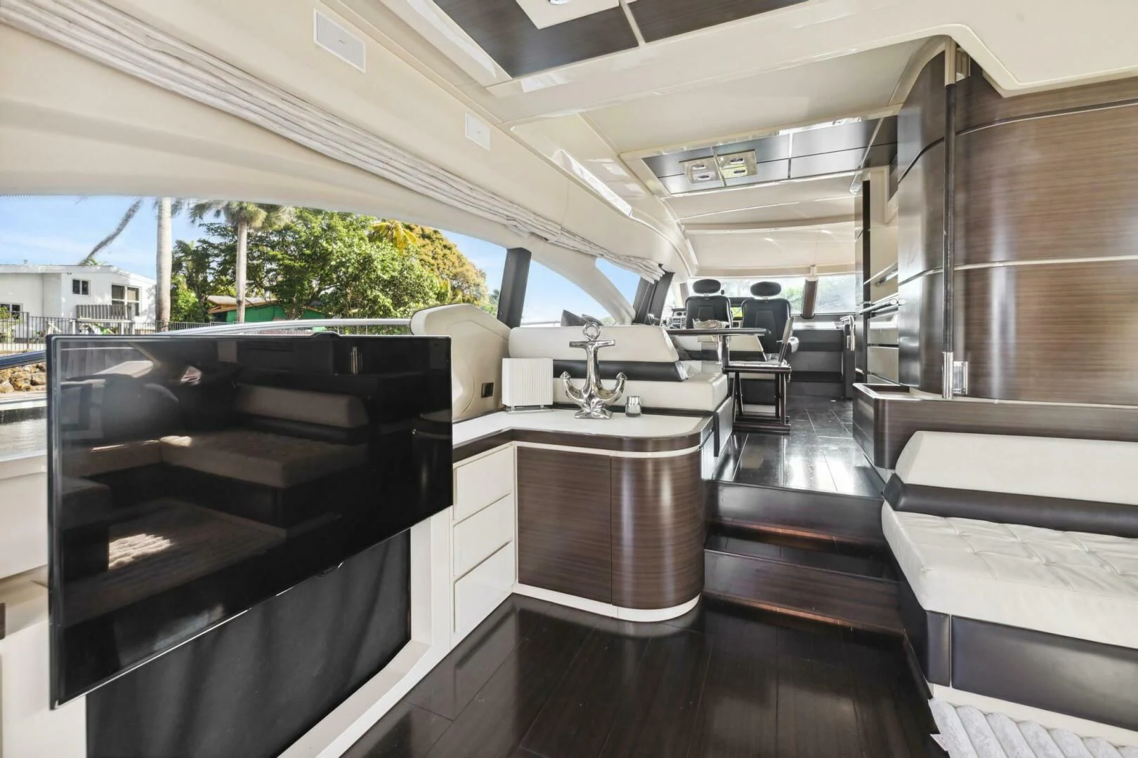 a room with a bench and a piano aboard SOMEWHERE I BELONG Yacht for Sale