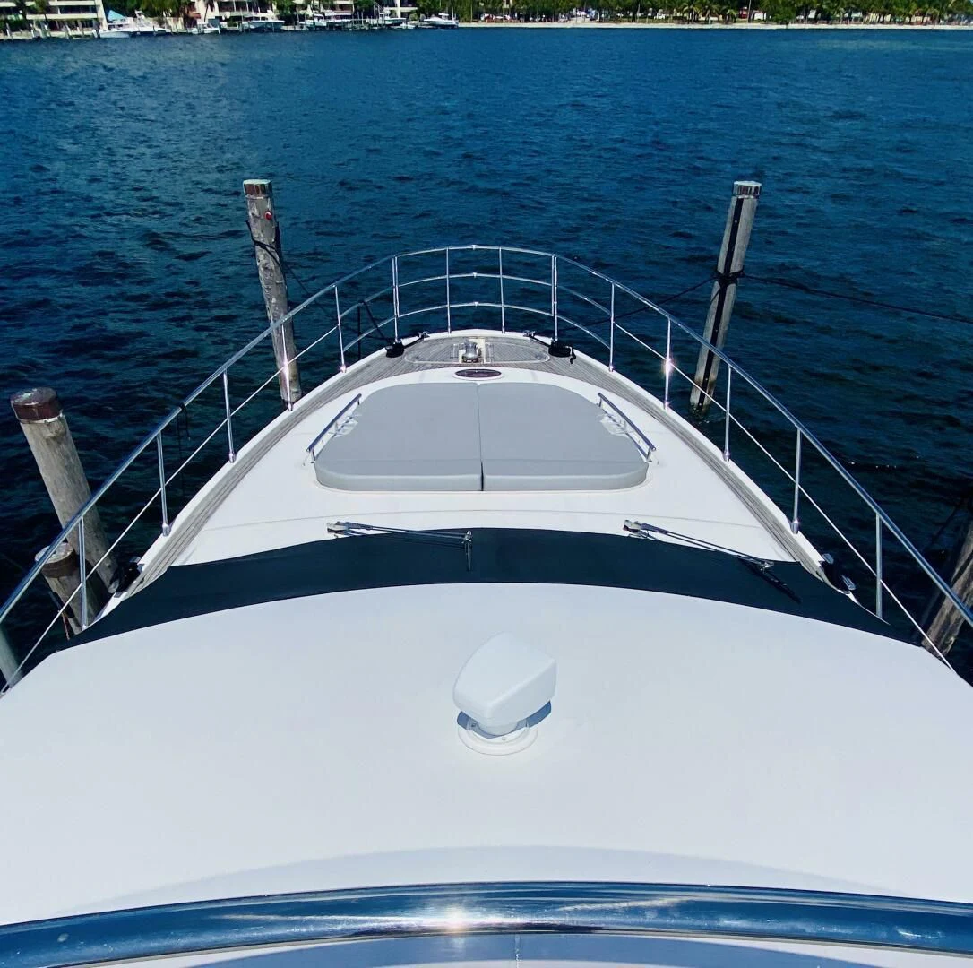 a white boat in the water aboard SOMEWHERE I BELONG Yacht for Sale