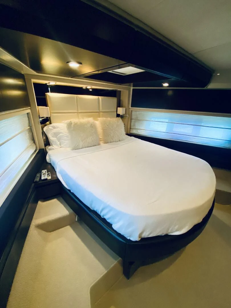a bed in a room aboard SOMEWHERE I BELONG Yacht for Sale