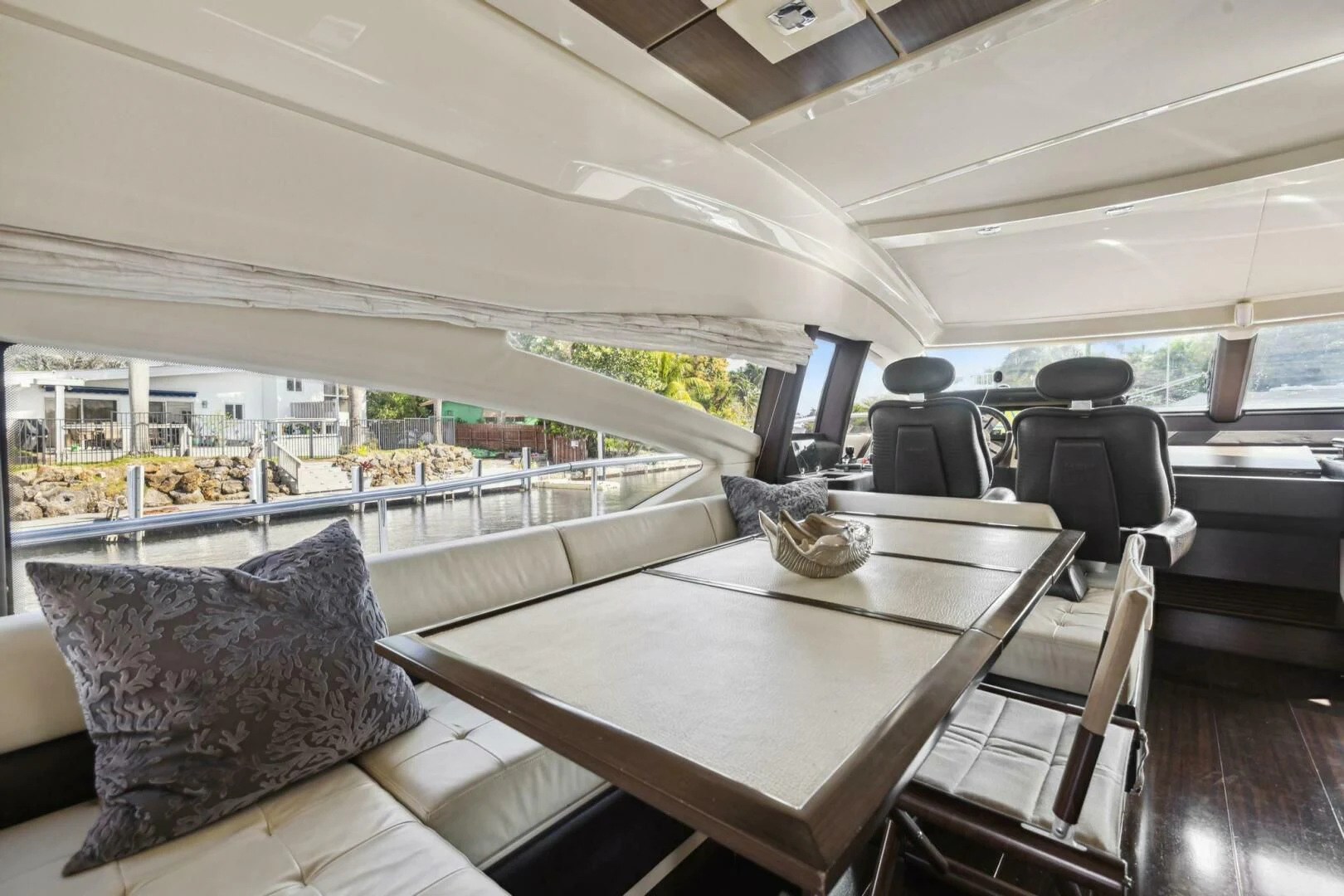 a room with a table and chairs aboard SOMEWHERE I BELONG Yacht for Sale