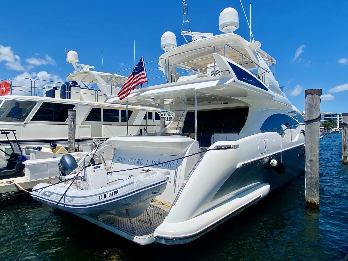 a boat docked at a pier aboard SOMEWHERE I BELONG Yacht for Sale