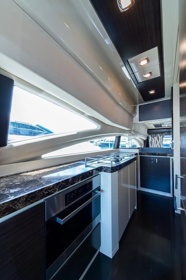 a kitchen with a large window aboard SOMEWHERE I BELONG Yacht for Sale