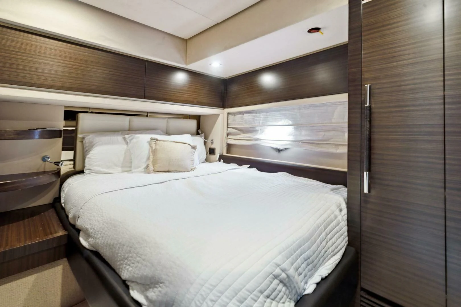 a bed in a room aboard SOMEWHERE I BELONG Yacht for Sale