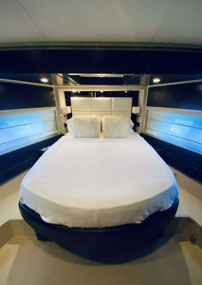 a bed in a room aboard SOMEWHERE I BELONG Yacht for Sale