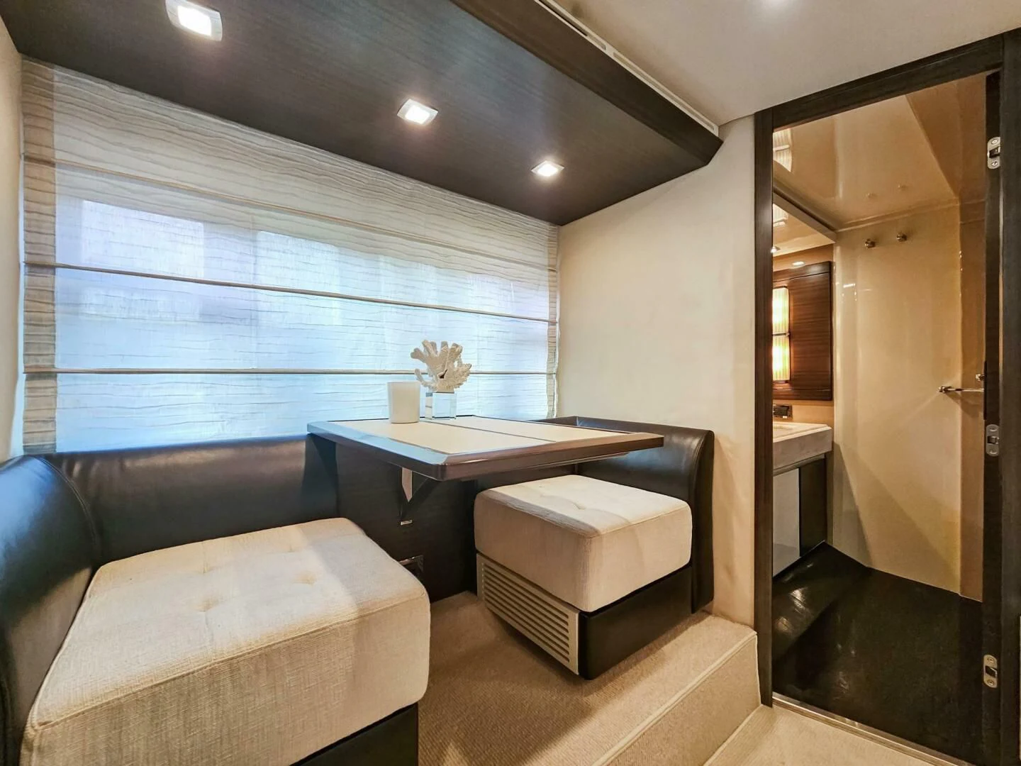 a room with a desk and a bed aboard SOMEWHERE I BELONG Yacht for Sale