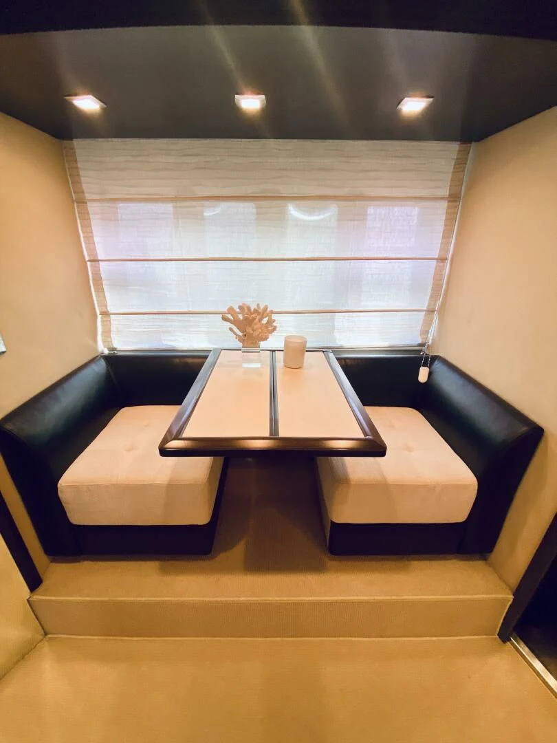 a coffee table in a room aboard SOMEWHERE I BELONG Yacht for Sale
