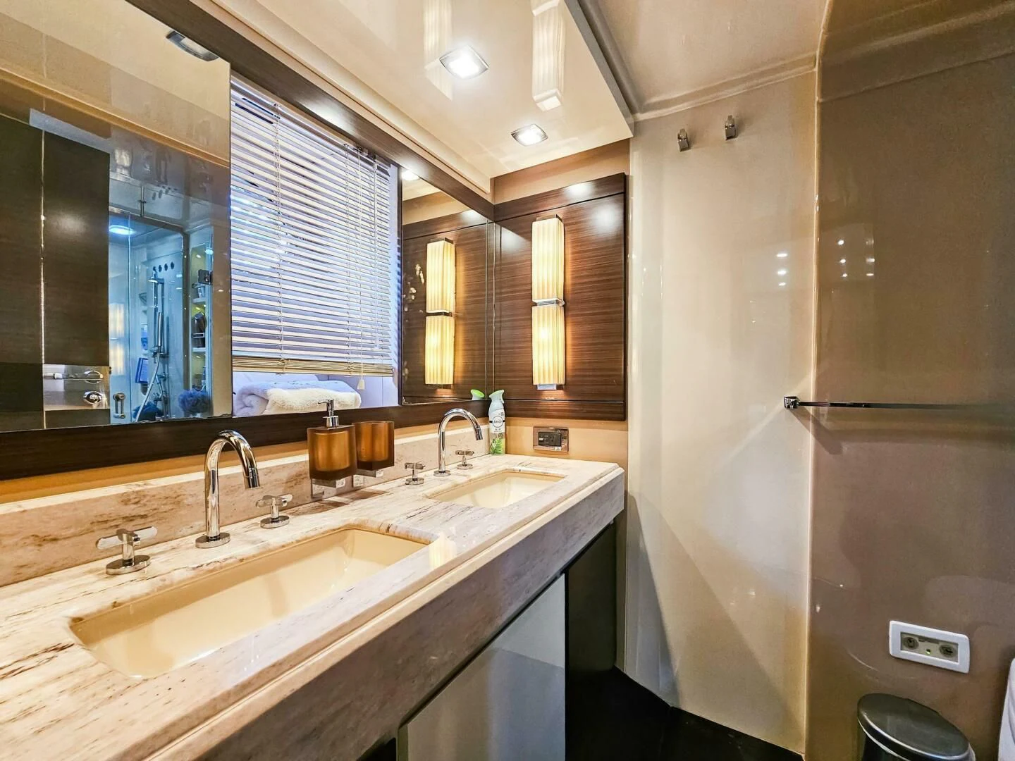 a bathroom with a large mirror aboard SOMEWHERE I BELONG Yacht for Sale