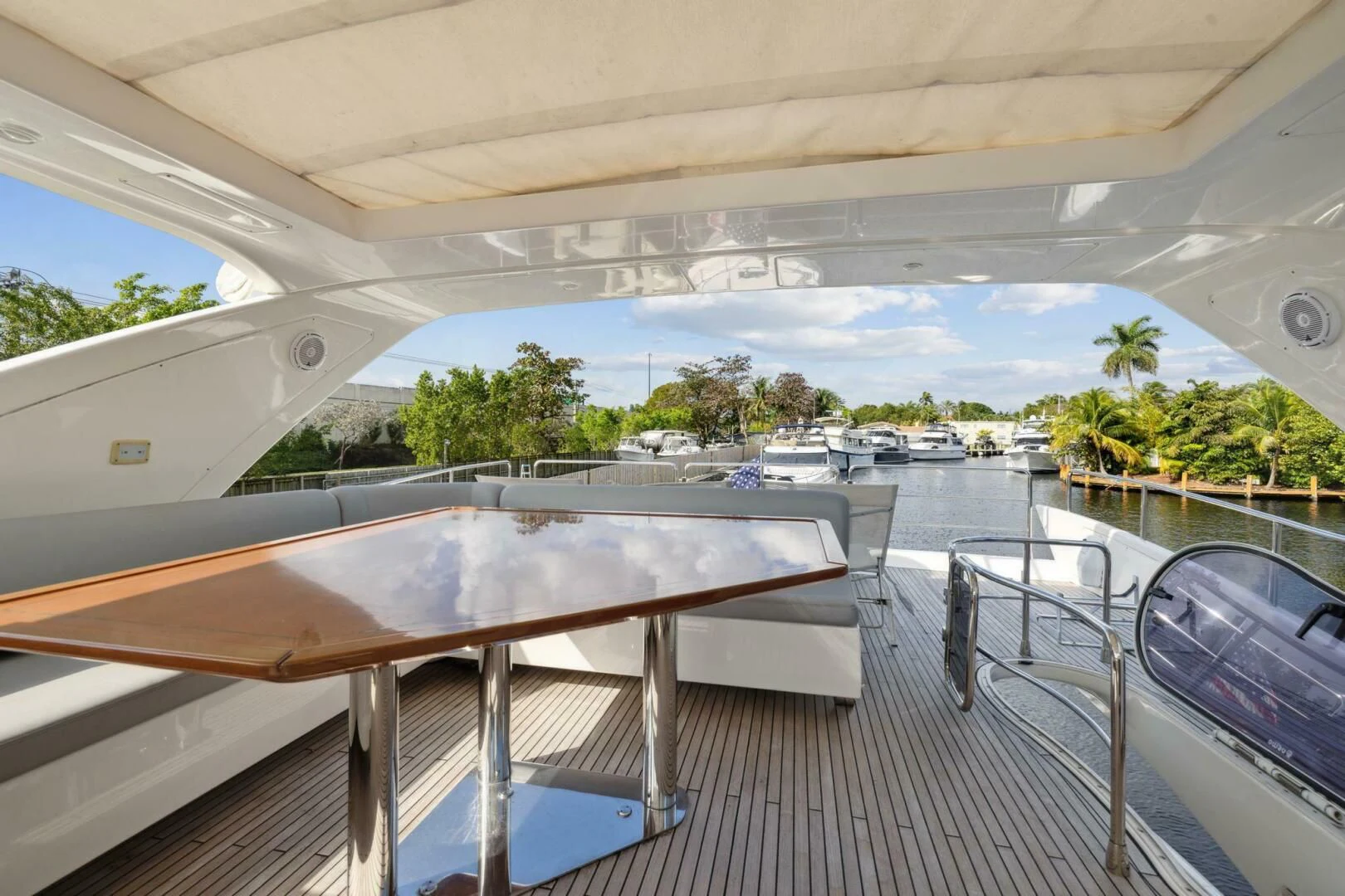 a deck with a pool and a view of a city aboard SOMEWHERE I BELONG Yacht for Sale