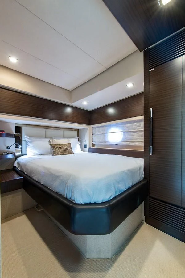 a bed in a room aboard SOMEWHERE I BELONG Yacht for Sale