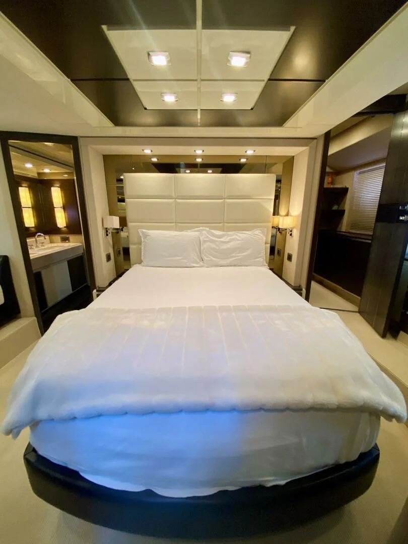 a large bed with a white sheet aboard SOMEWHERE I BELONG Yacht for Sale