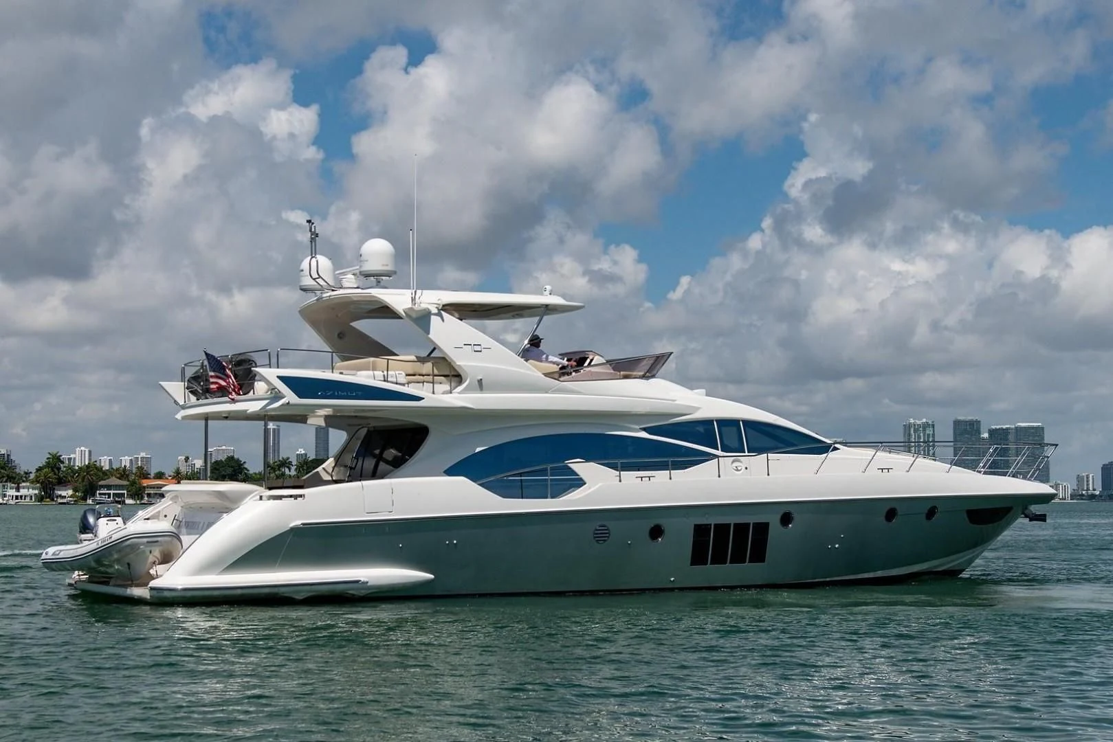 a white yacht in the water aboard SOMEWHERE I BELONG Yacht for Sale