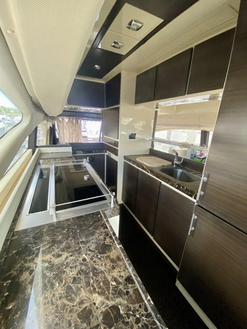 a bathroom with a marble floor aboard SOMEWHERE I BELONG Yacht for Sale