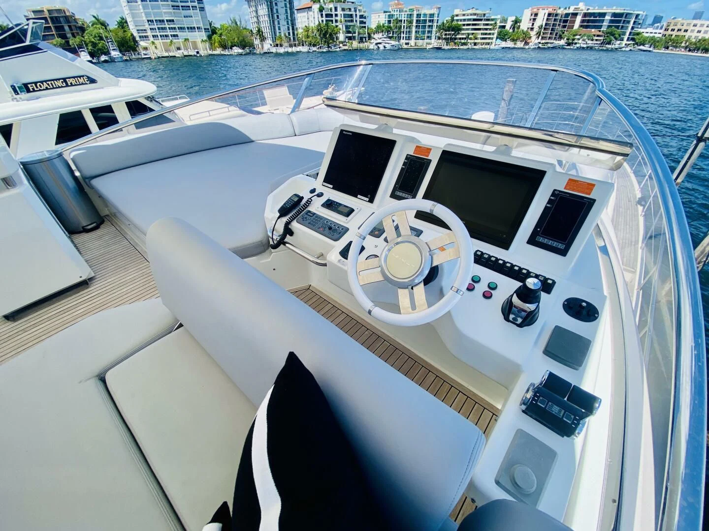 a white boat with a black and orange stripe on the front aboard SOMEWHERE I BELONG Yacht for Sale