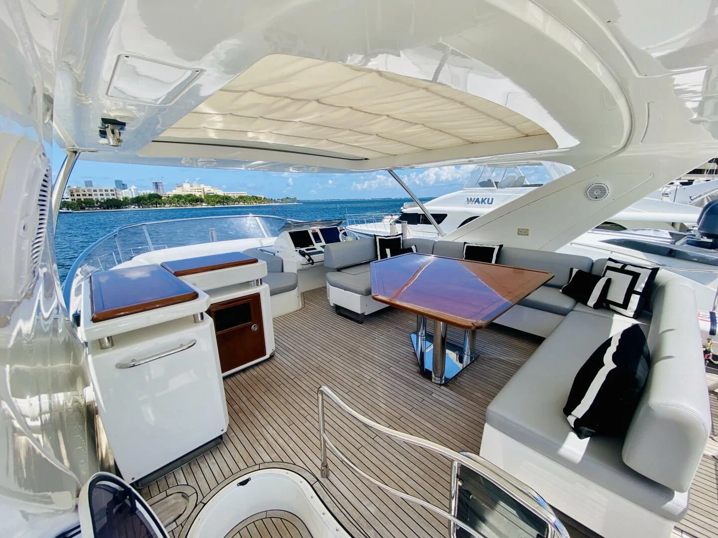 a boat with a table and chairs aboard SOMEWHERE I BELONG Yacht for Sale