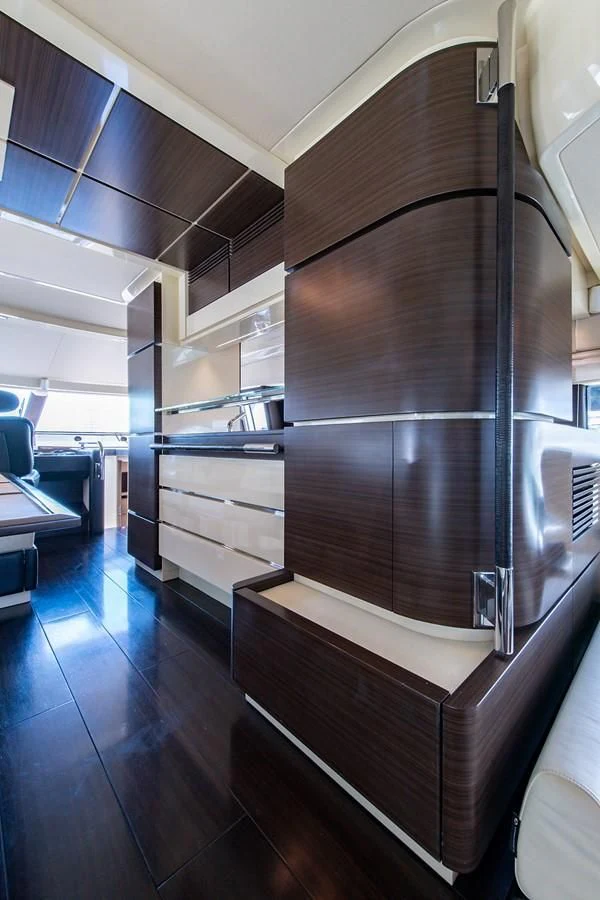 a room with wooden furniture aboard SOMEWHERE I BELONG Yacht for Sale