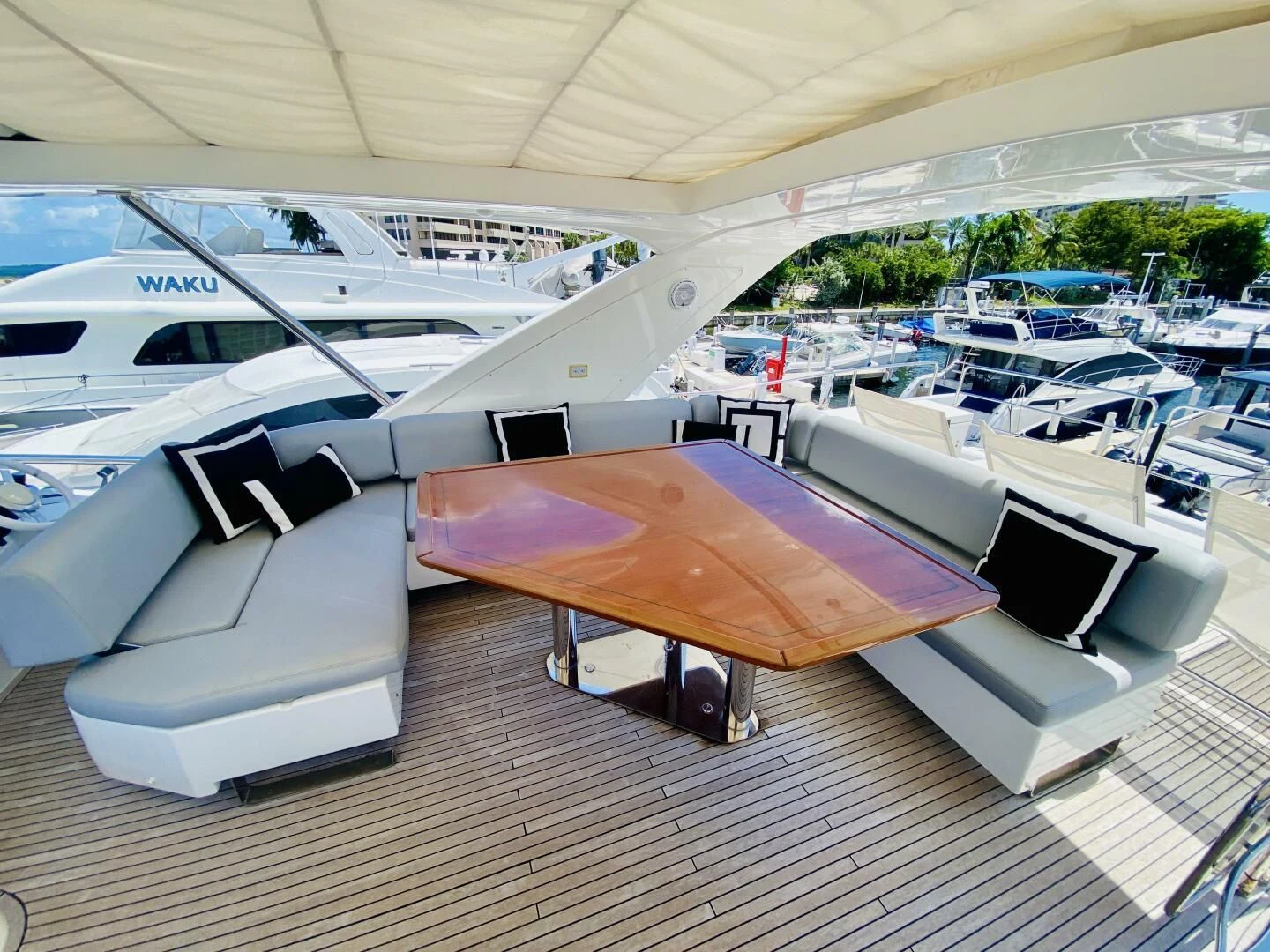 a room with a table and chairs aboard SOMEWHERE I BELONG Yacht for Sale