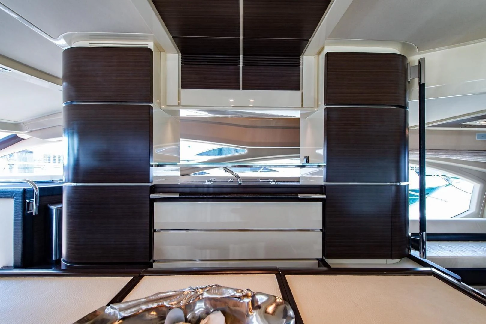 a large metal cabinet with a metal rack aboard SOMEWHERE I BELONG Yacht for Sale