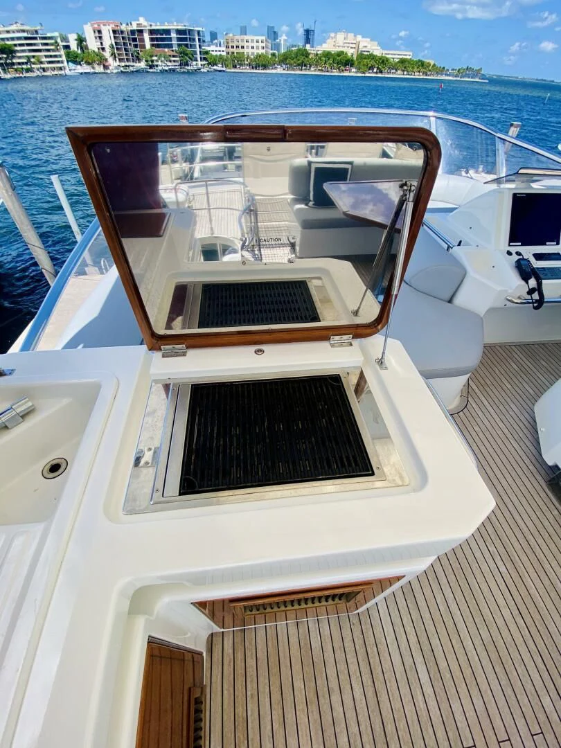 a boat with a black and white cover on the front aboard SOMEWHERE I BELONG Yacht for Sale