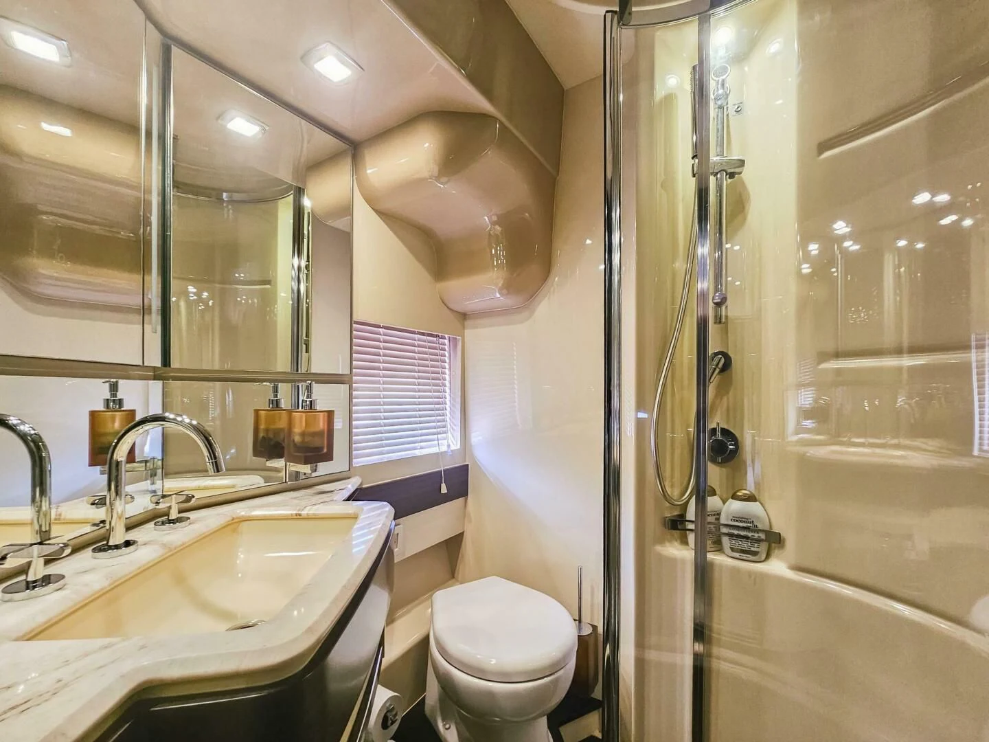 a bathroom with a glass shower aboard SOMEWHERE I BELONG Yacht for Sale