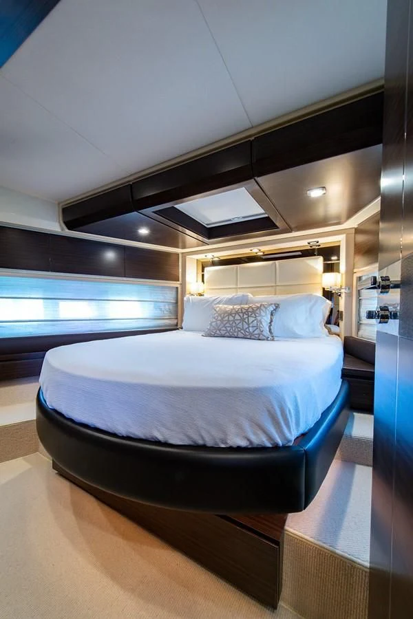 a bed in a room aboard SOMEWHERE I BELONG Yacht for Sale