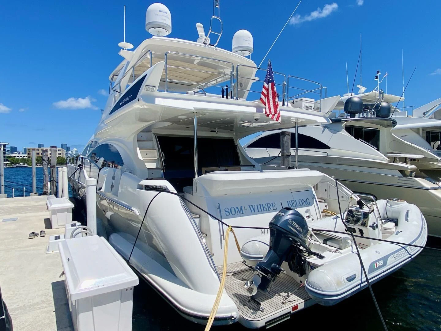 a boat docked at a pier aboard SOMEWHERE I BELONG Yacht for Sale