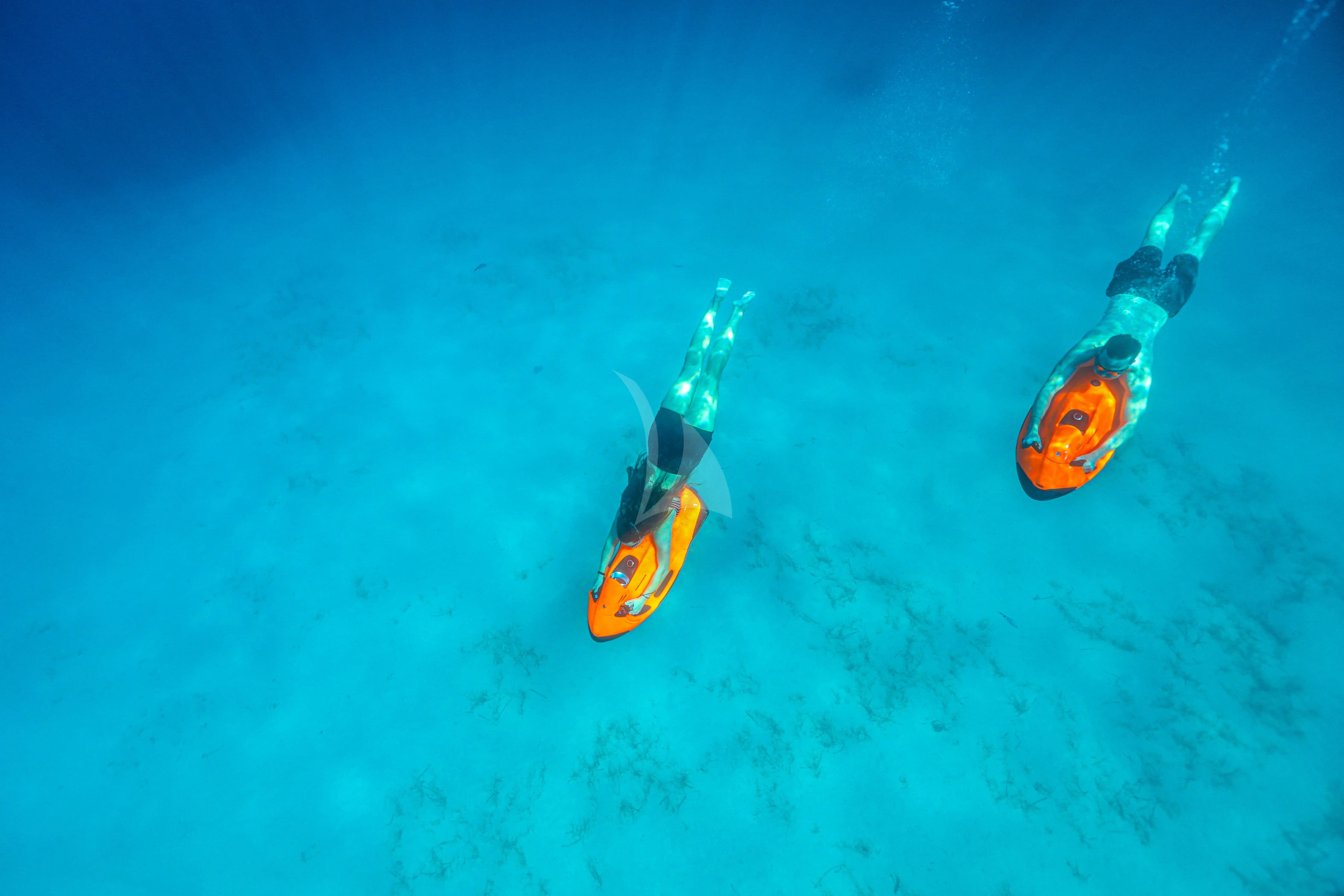 a pair of sunglasses on a blue surface aboard FIGURATI Yacht for Sale