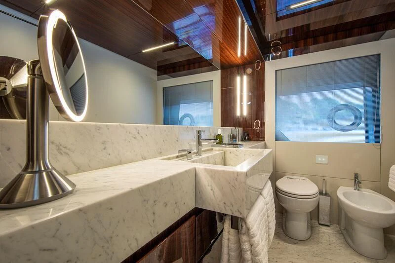 a bathroom with a large mirror aboard FIGURATI Yacht for Sale