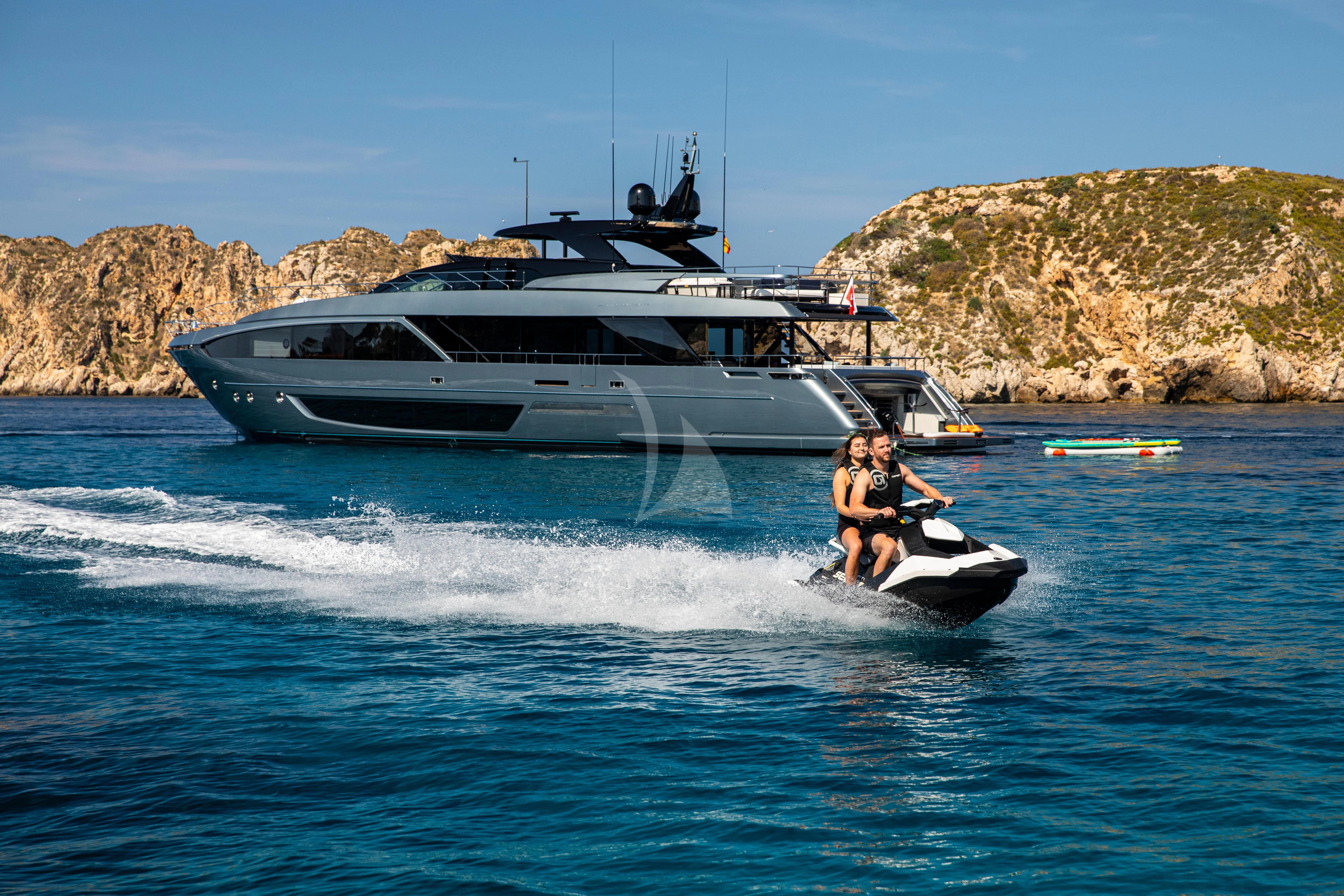 a man and a boy on a boat in the water aboard FIGURATI Yacht for Sale