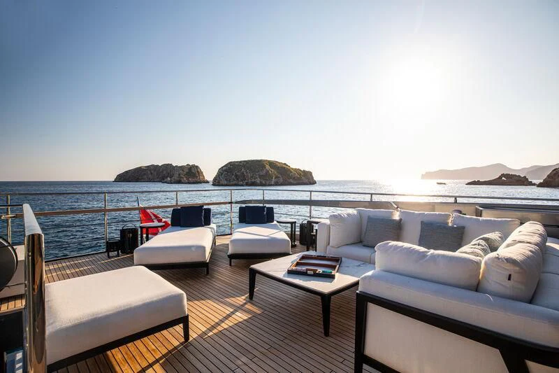 a living room with a large body of water and a large rock aboard FIGURATI Yacht for Sale