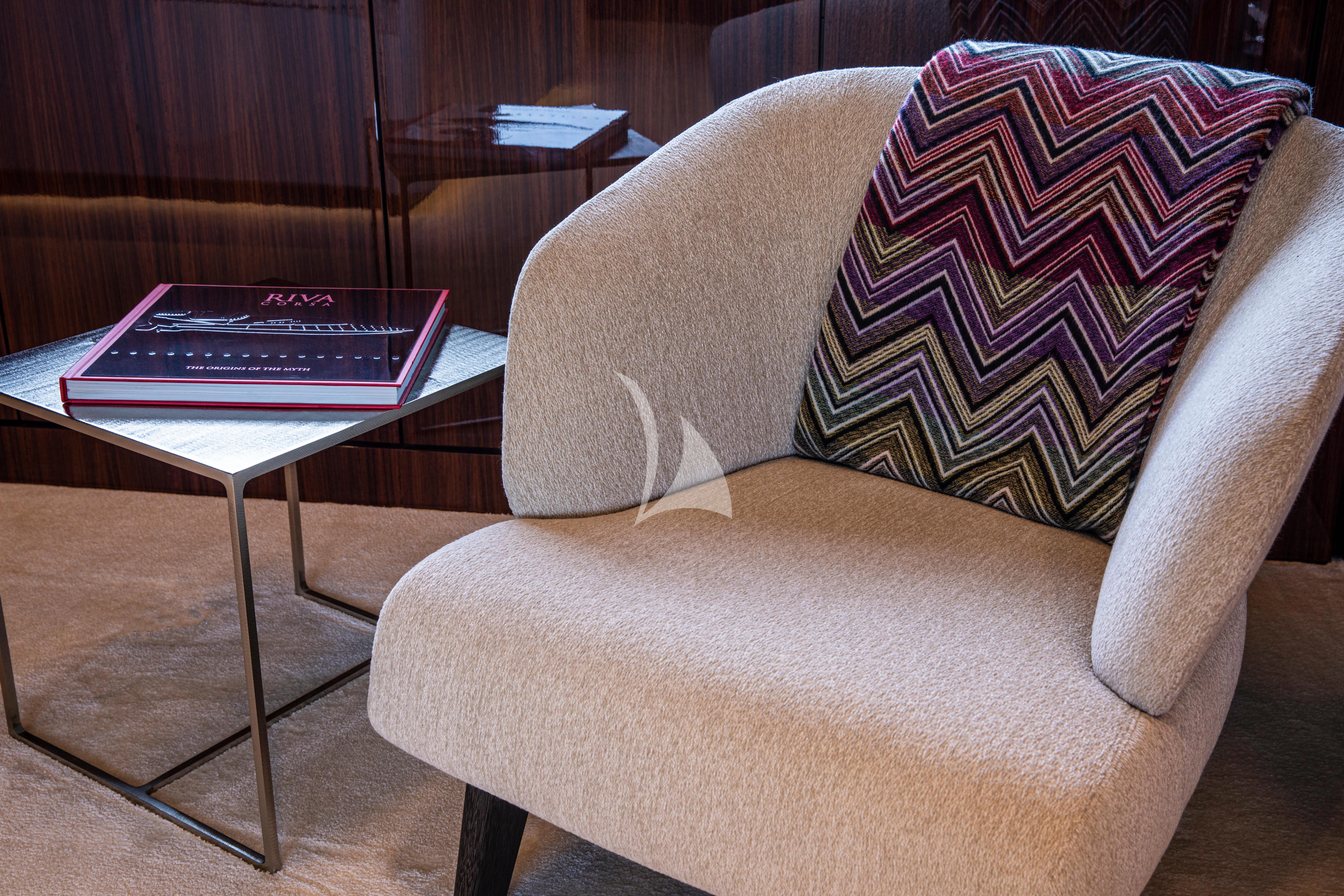 a couch with a coffee table aboard FIGURATI Yacht for Sale