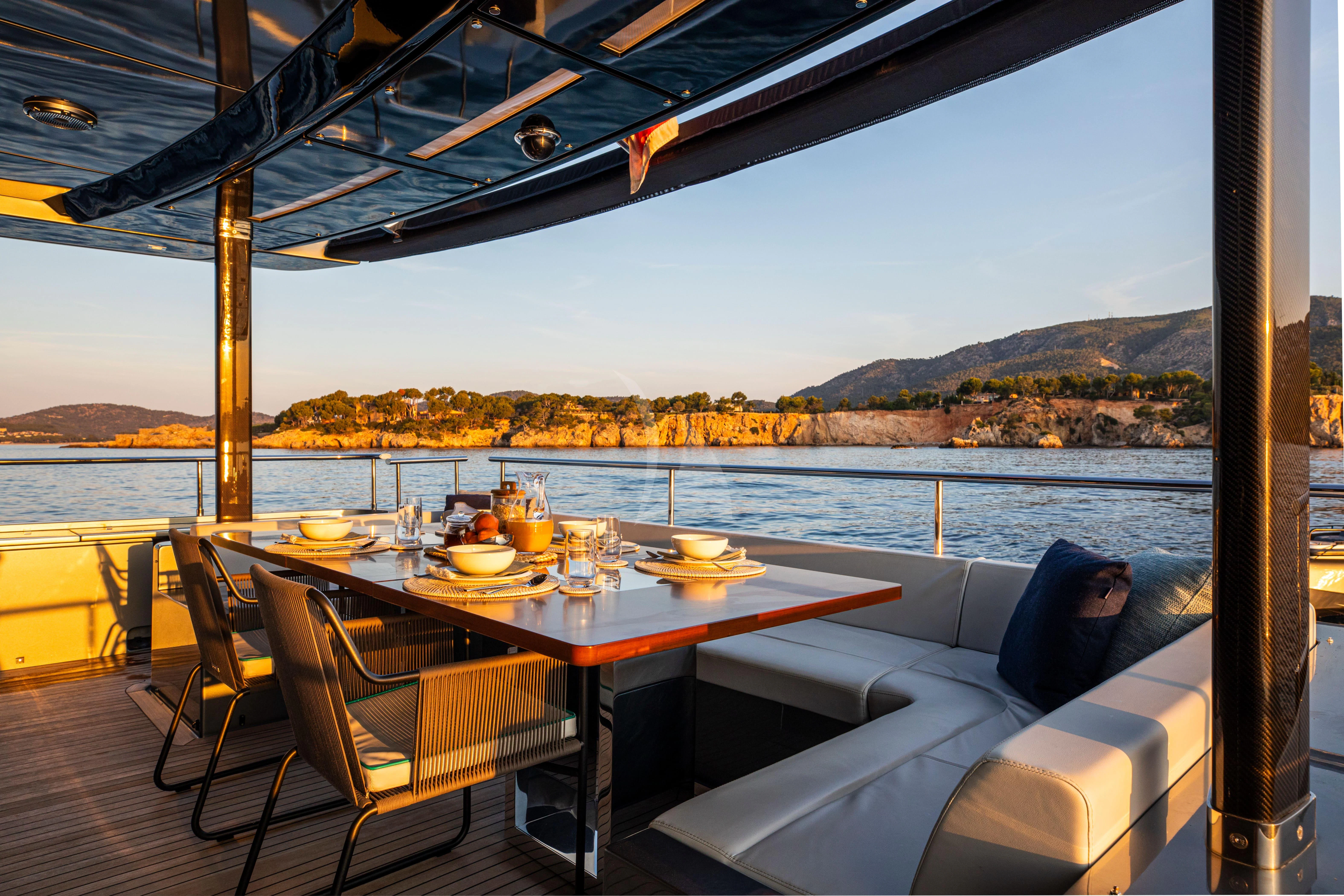 a table with food on it aboard FIGURATI Yacht for Sale