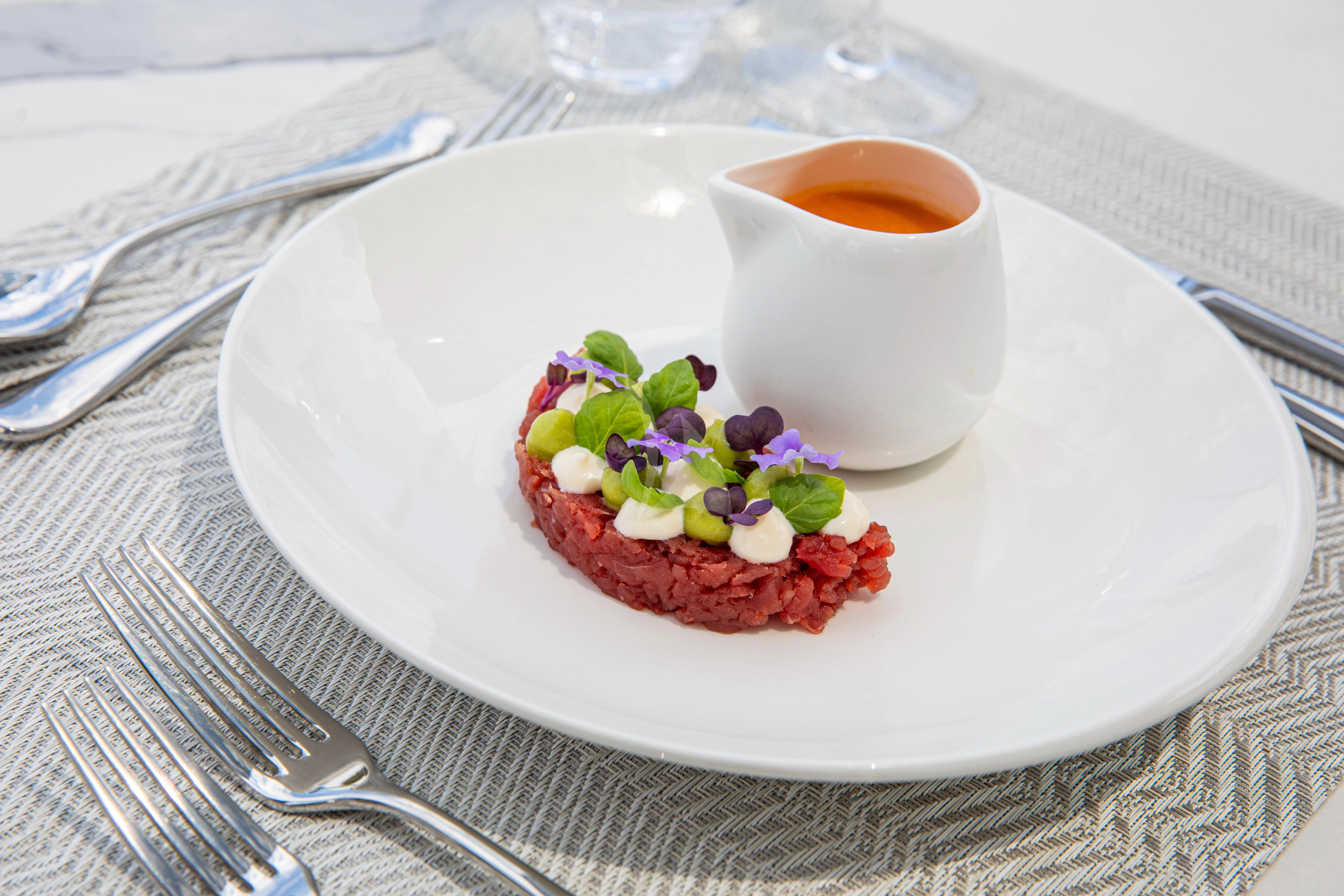 a plate with food on it aboard FIGURATI Yacht for Sale