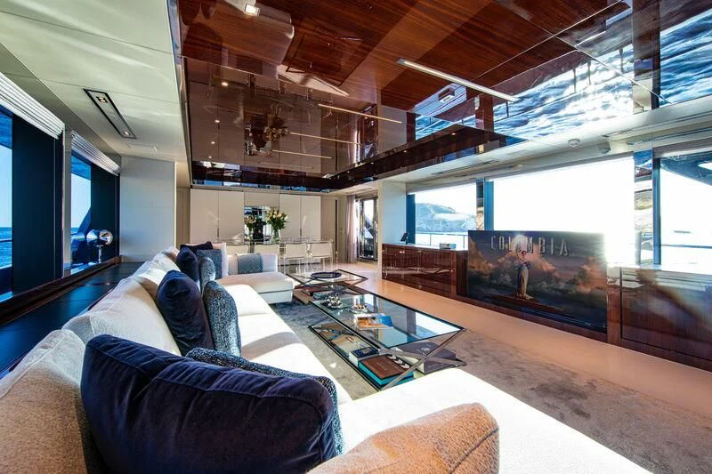 a living room with a large window aboard FIGURATI Yacht for Sale