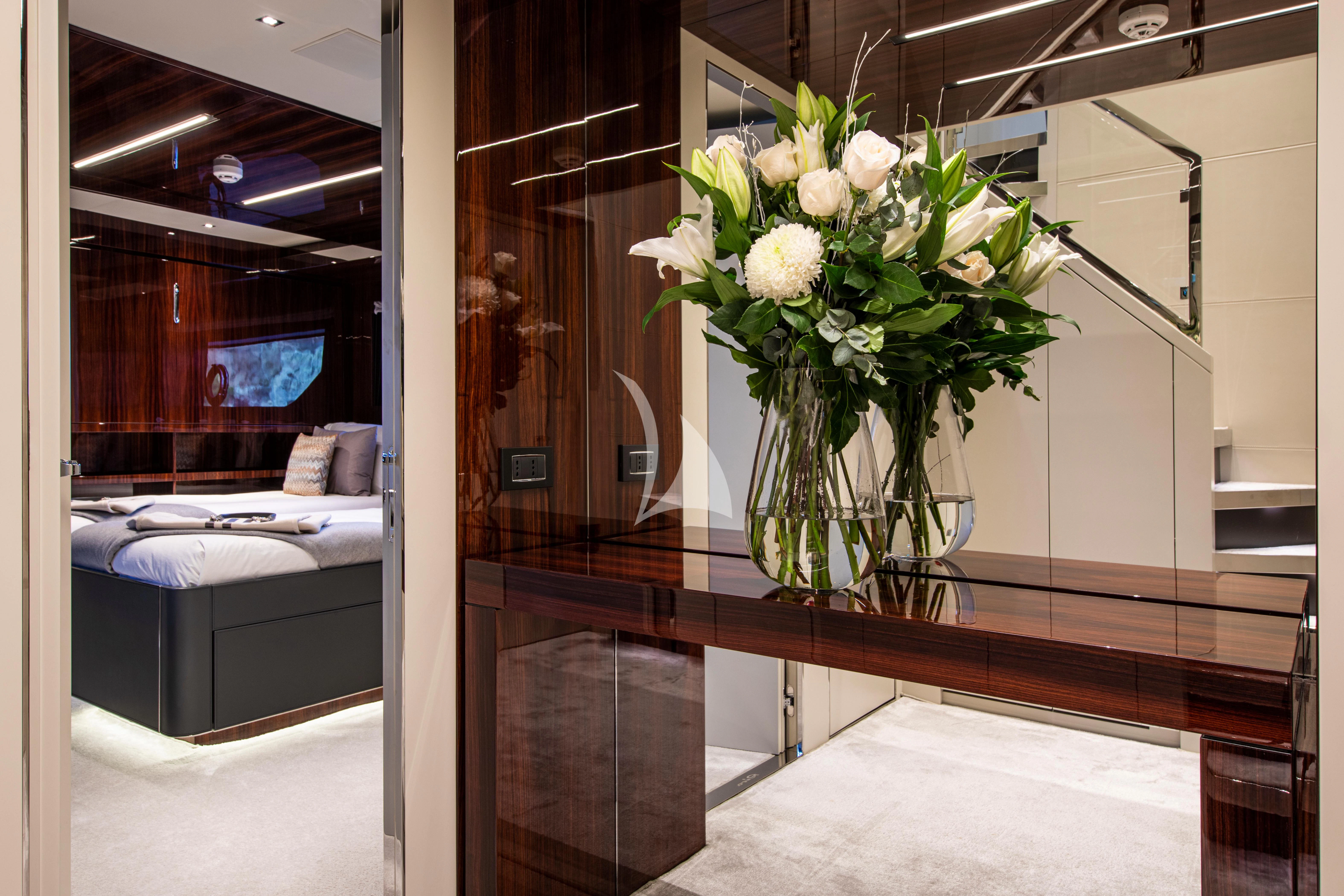 a vase of flowers on a table aboard FIGURATI Yacht for Sale