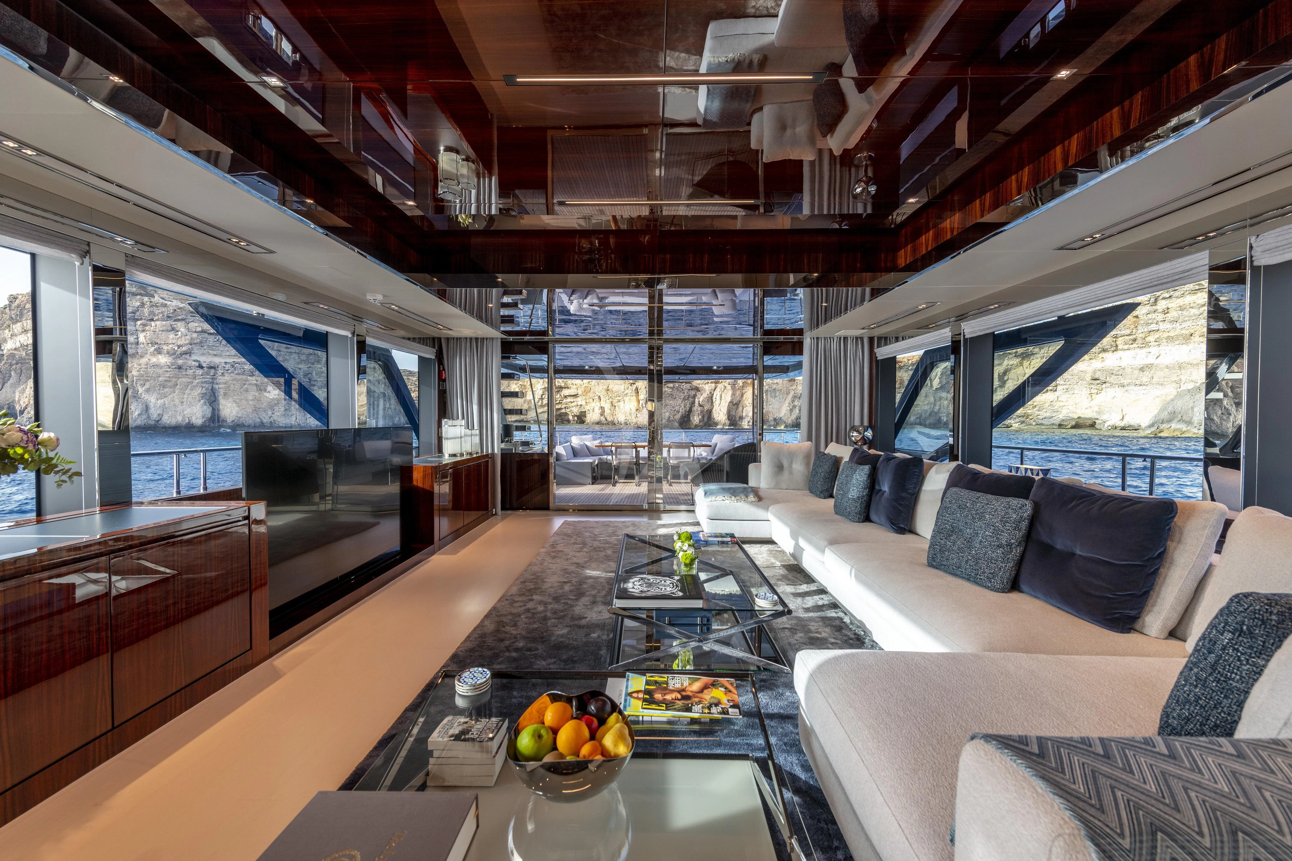 a living room with a large window aboard FIGURATI Yacht for Sale