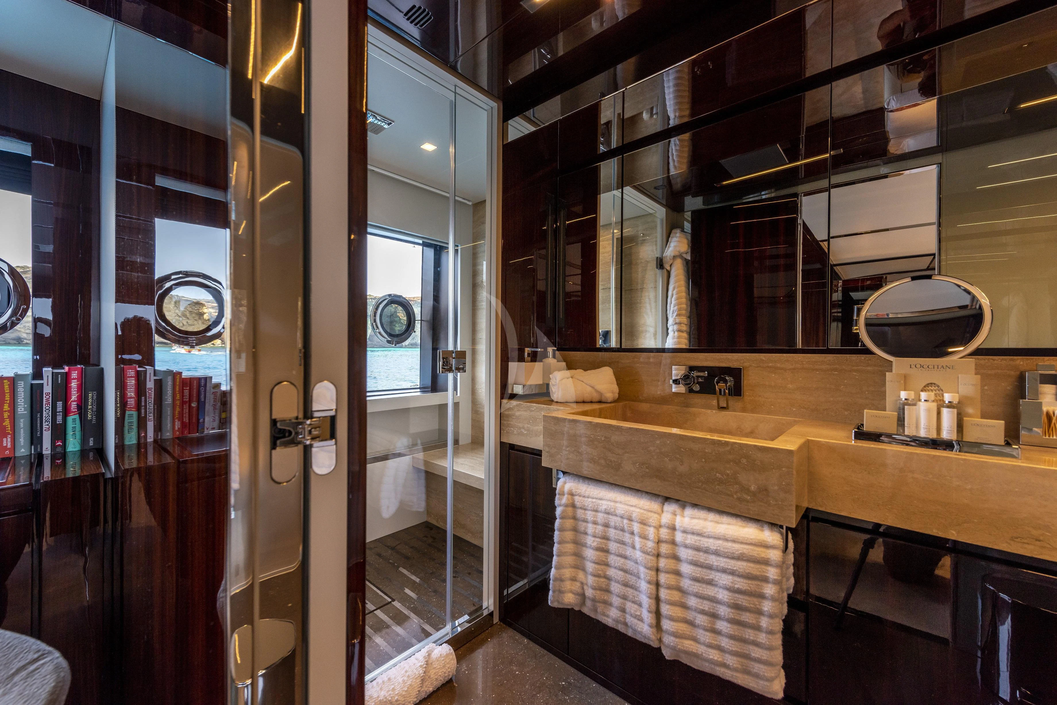 a bathroom with a large mirror aboard FIGURATI Yacht for Sale
