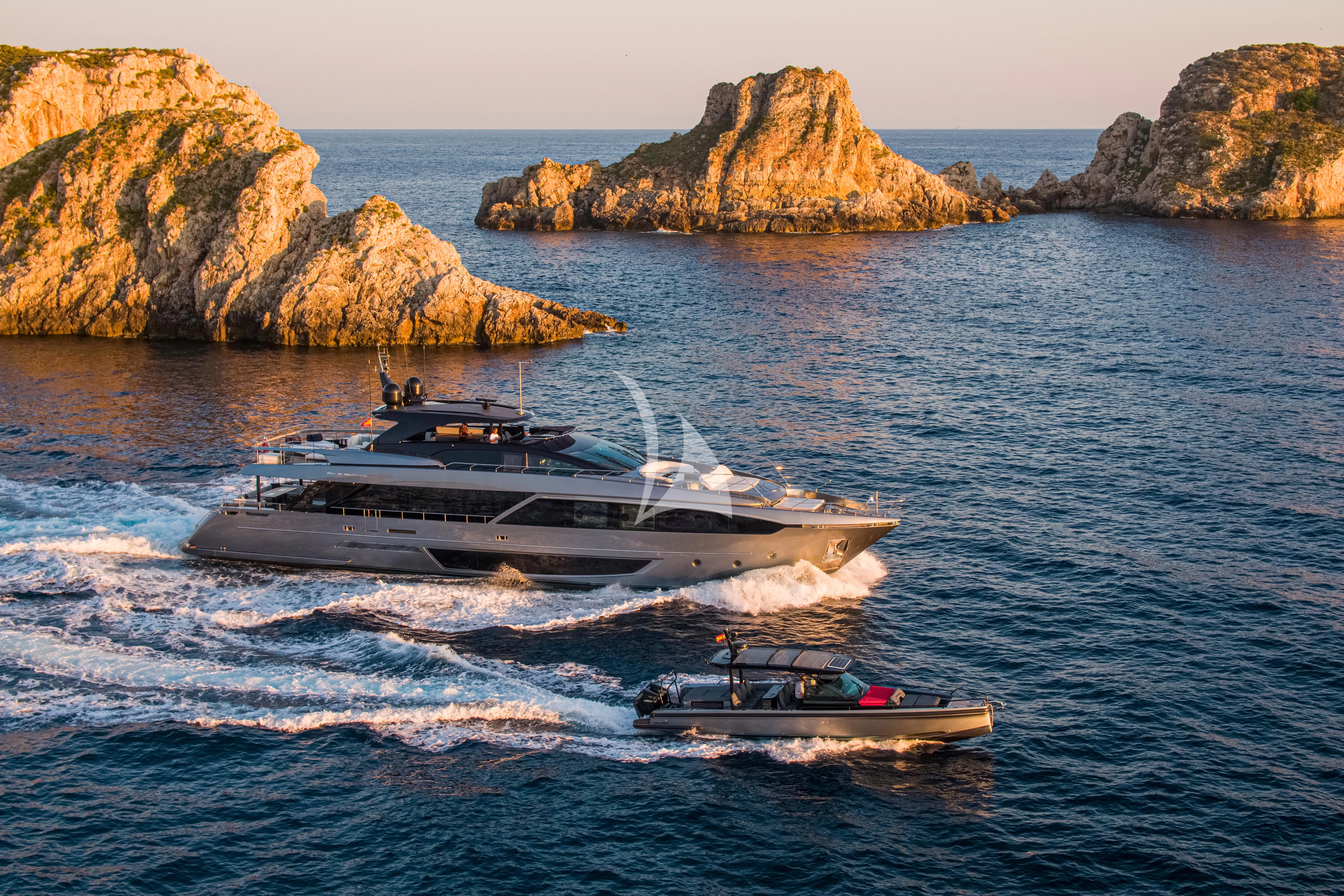 a couple of boats on the water aboard FIGURATI Yacht for Sale