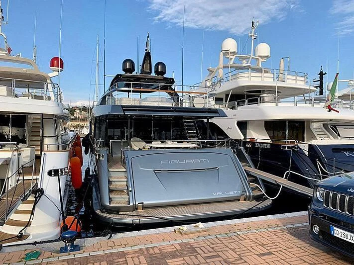 a group of boats are parked in a harbor aboard FIGURATI Yacht for Sale