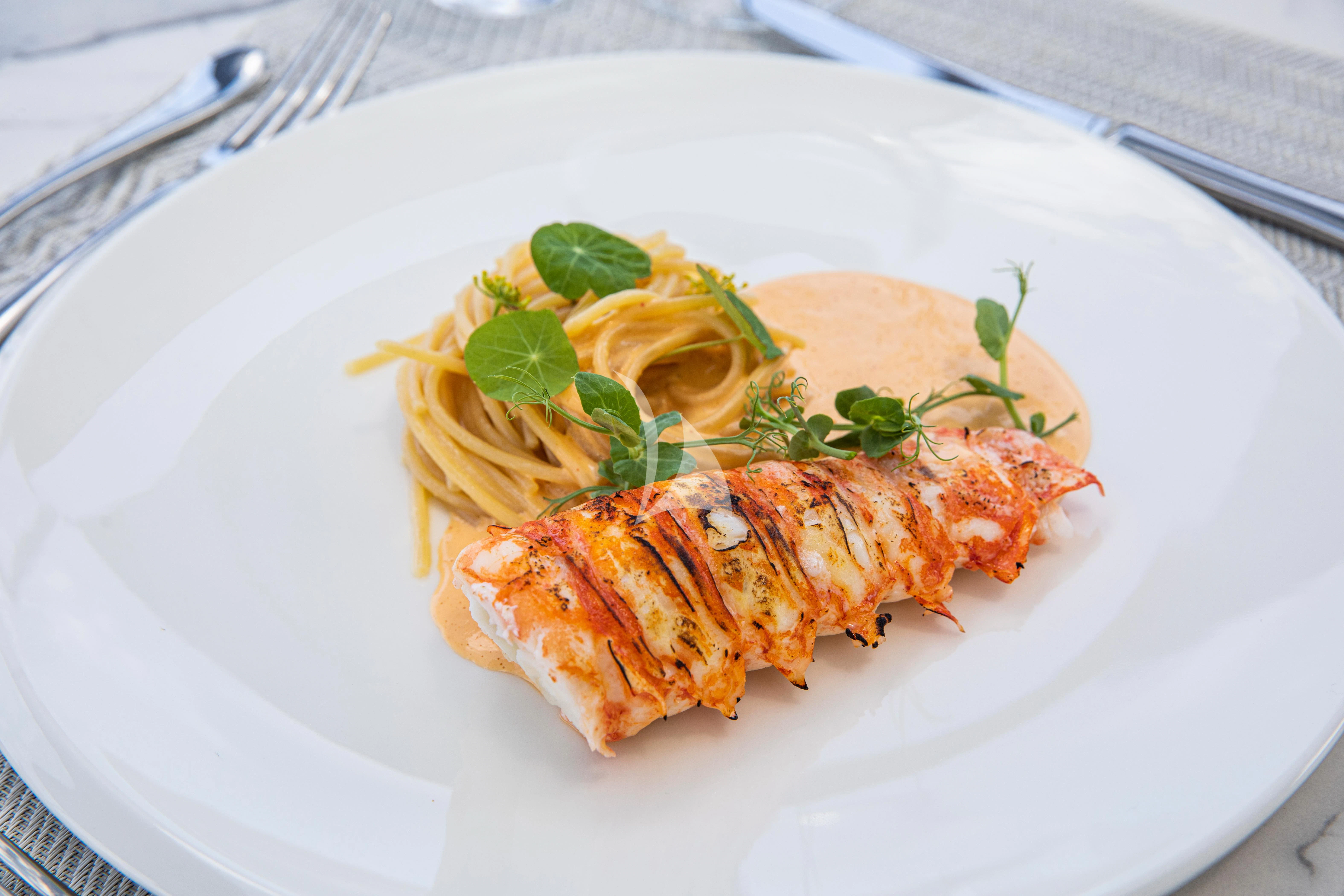 a plate of food aboard FIGURATI Yacht for Sale