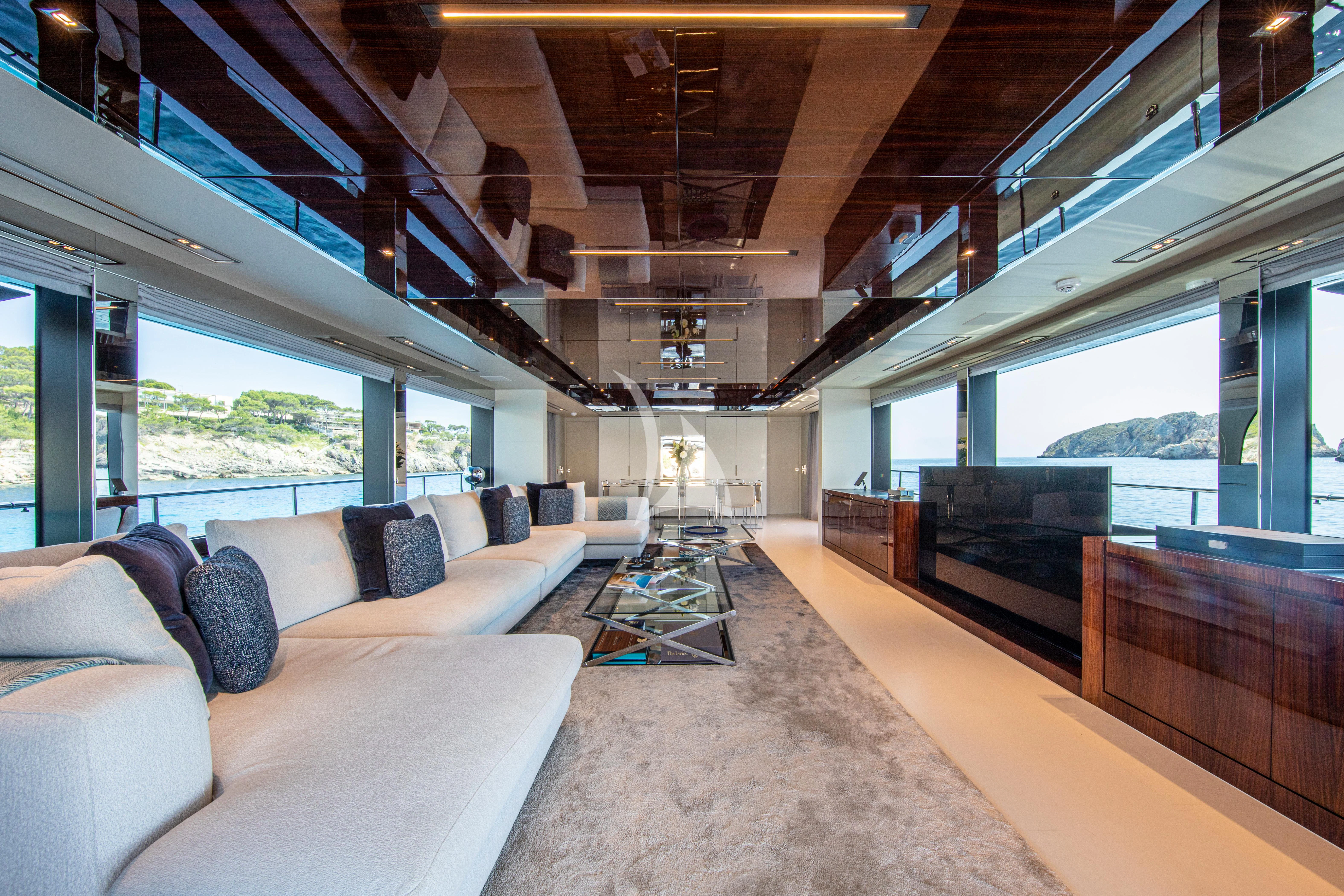 a living room with a large window aboard FIGURATI Yacht for Sale