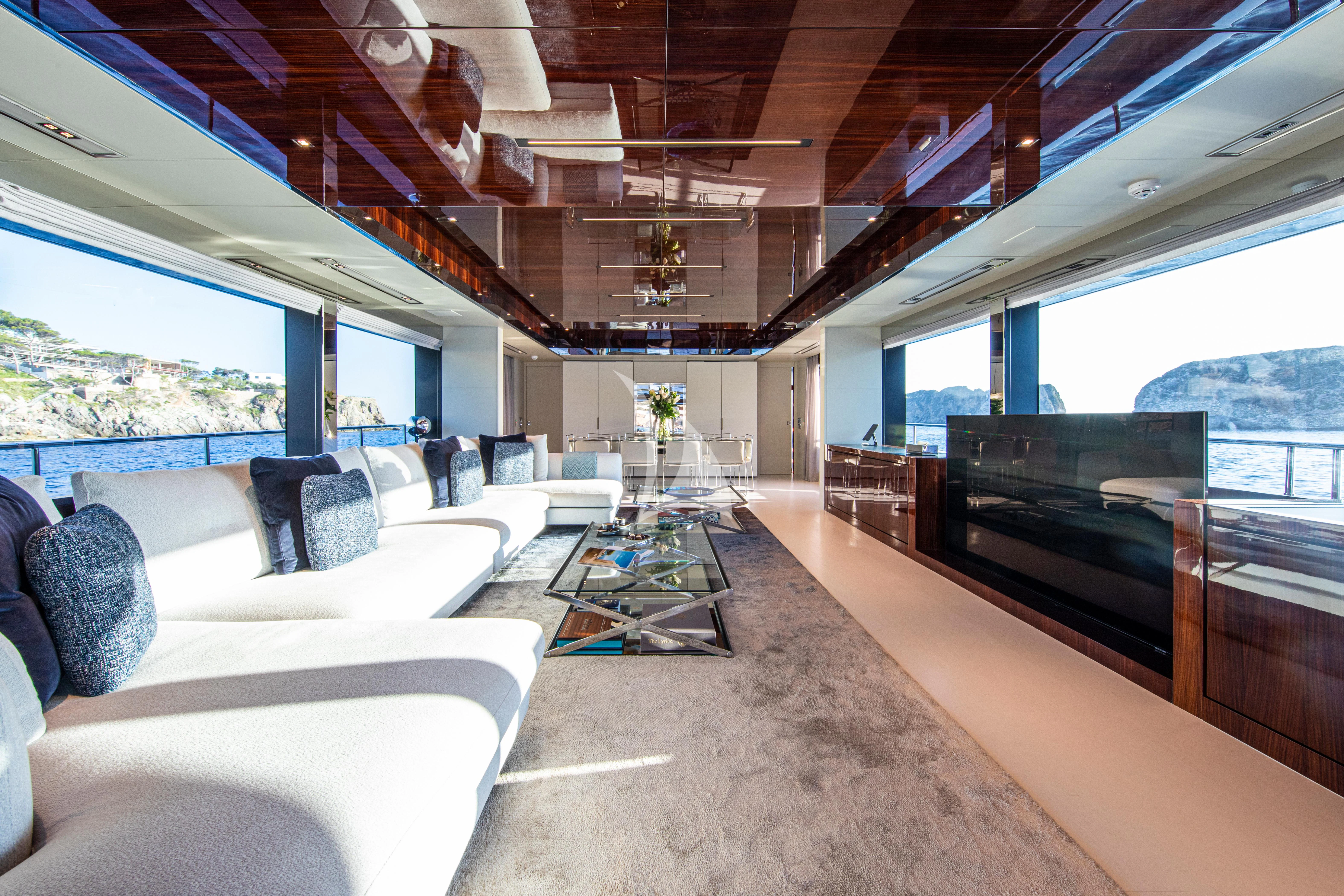 a living room with a piano aboard FIGURATI Yacht for Sale