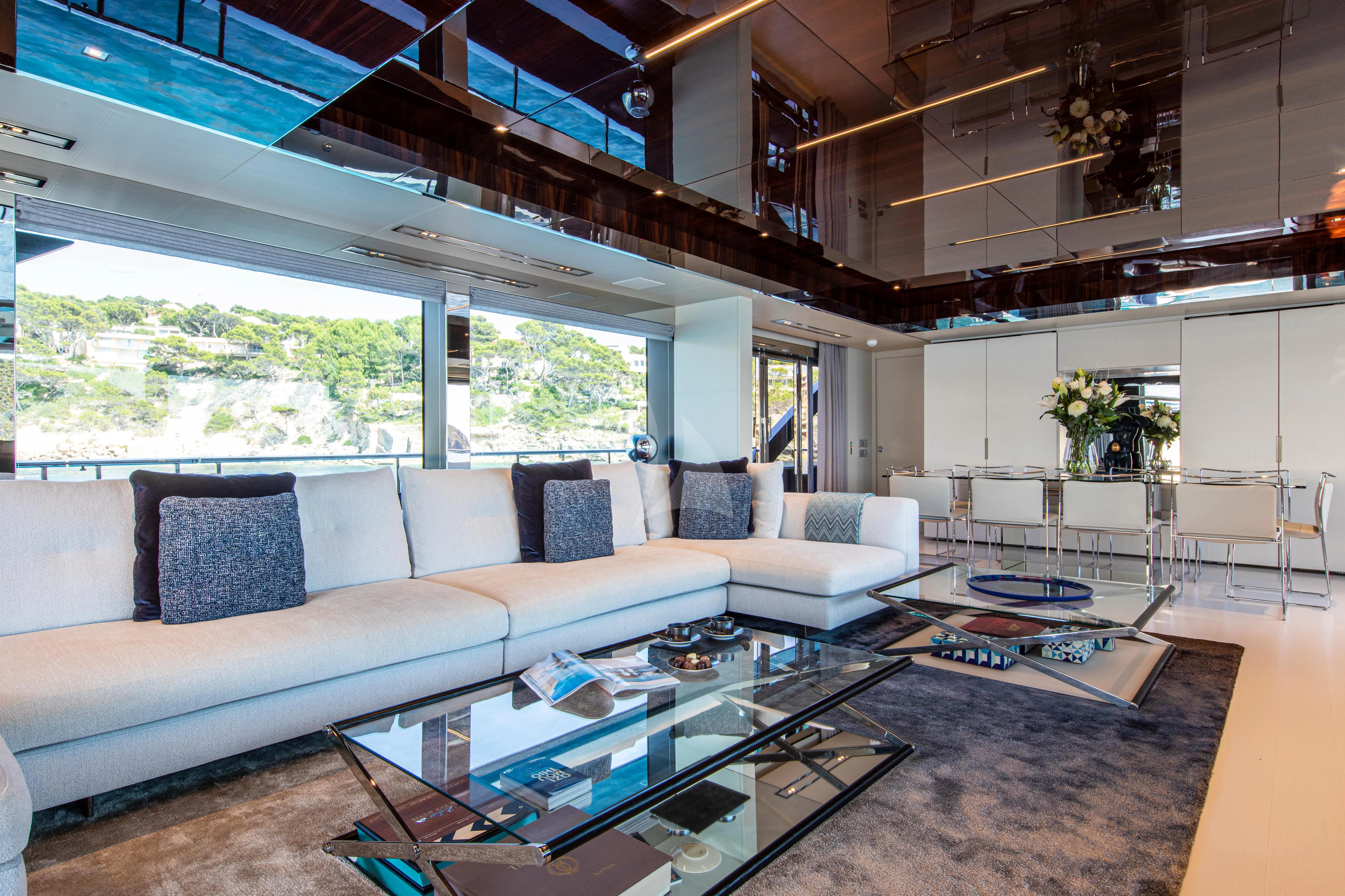 a living room with a large window aboard FIGURATI Yacht for Sale