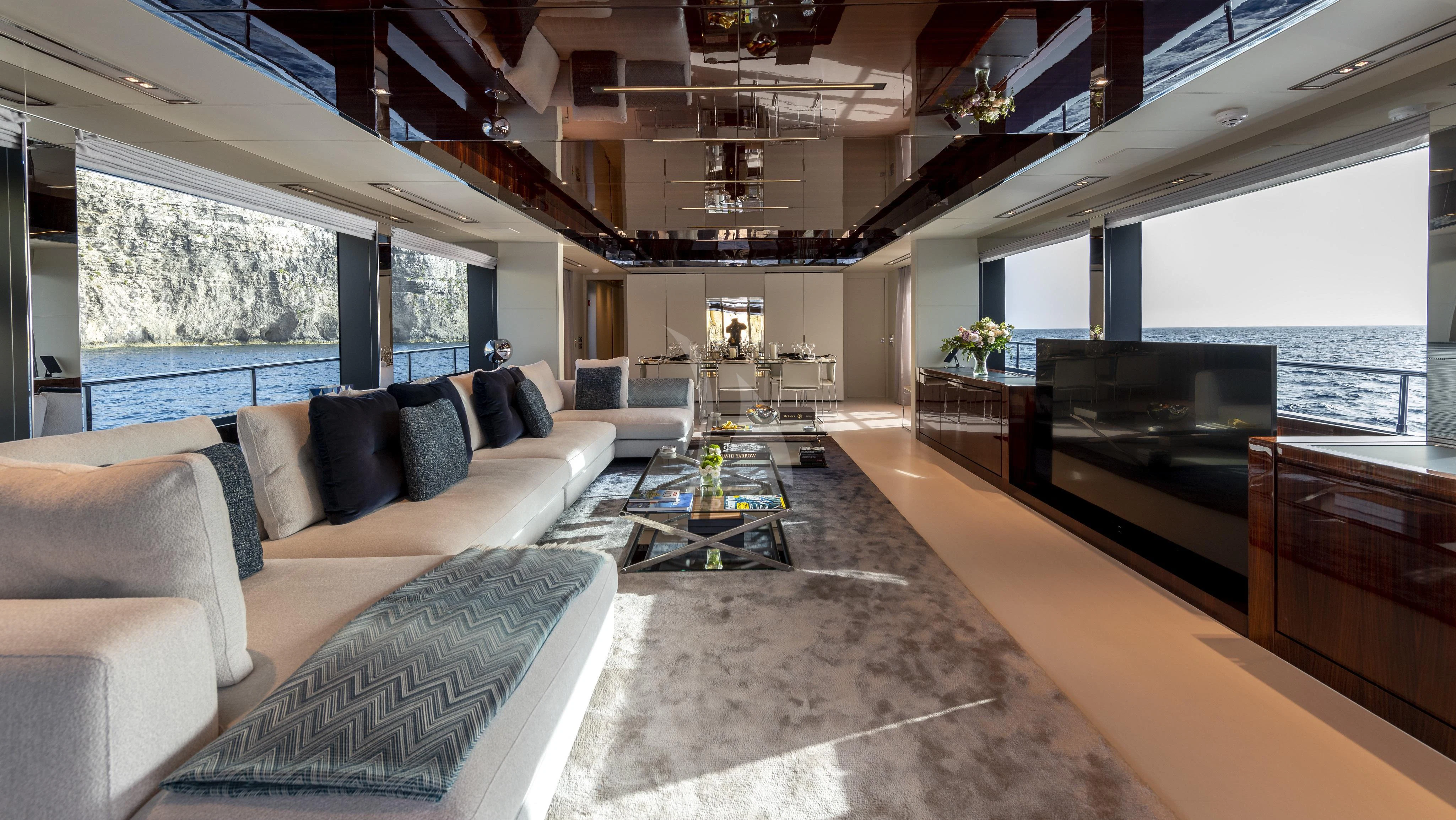 a living room with a fireplace aboard FIGURATI Yacht for Sale
