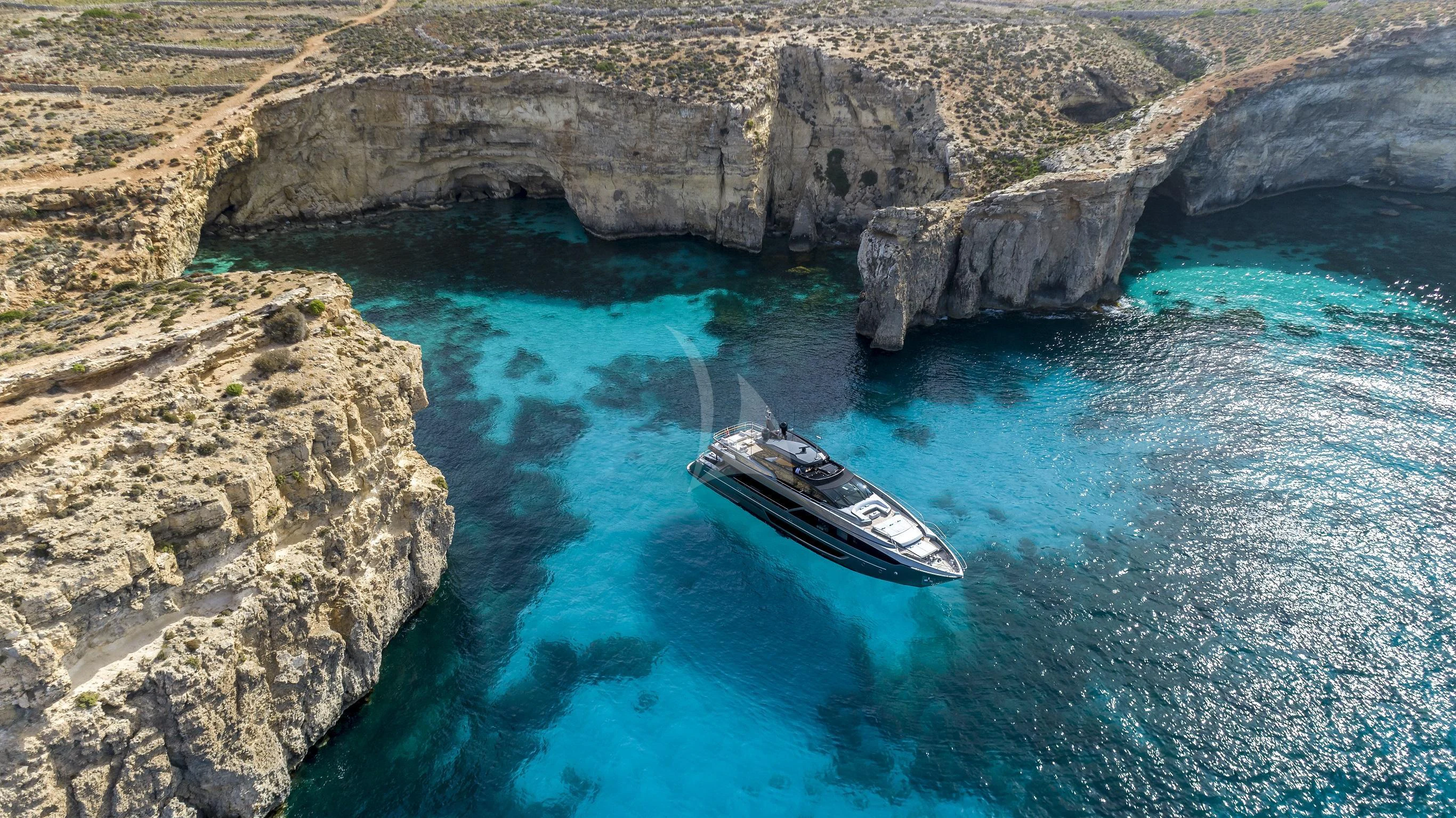 a phone on a rock in the water aboard FIGURATI Yacht for Sale